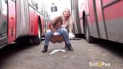 Video sex 2021 This stunning blonde in denim jeans walks through the city and decides to relieve her pee deseperation by squatting between two parked buses comma leaving a nice juicy wet puddle behind high speed